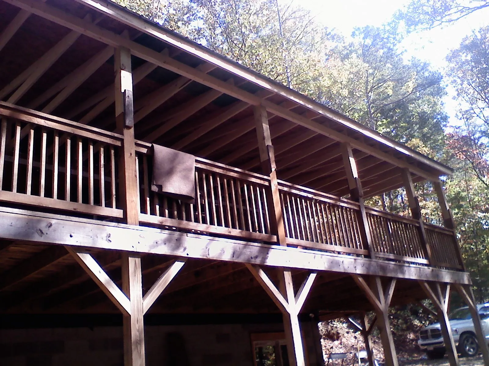 Timber framing under a new elevated porch and deck — Roof Leak Repair in East Falmouth by Roofing Brothers
